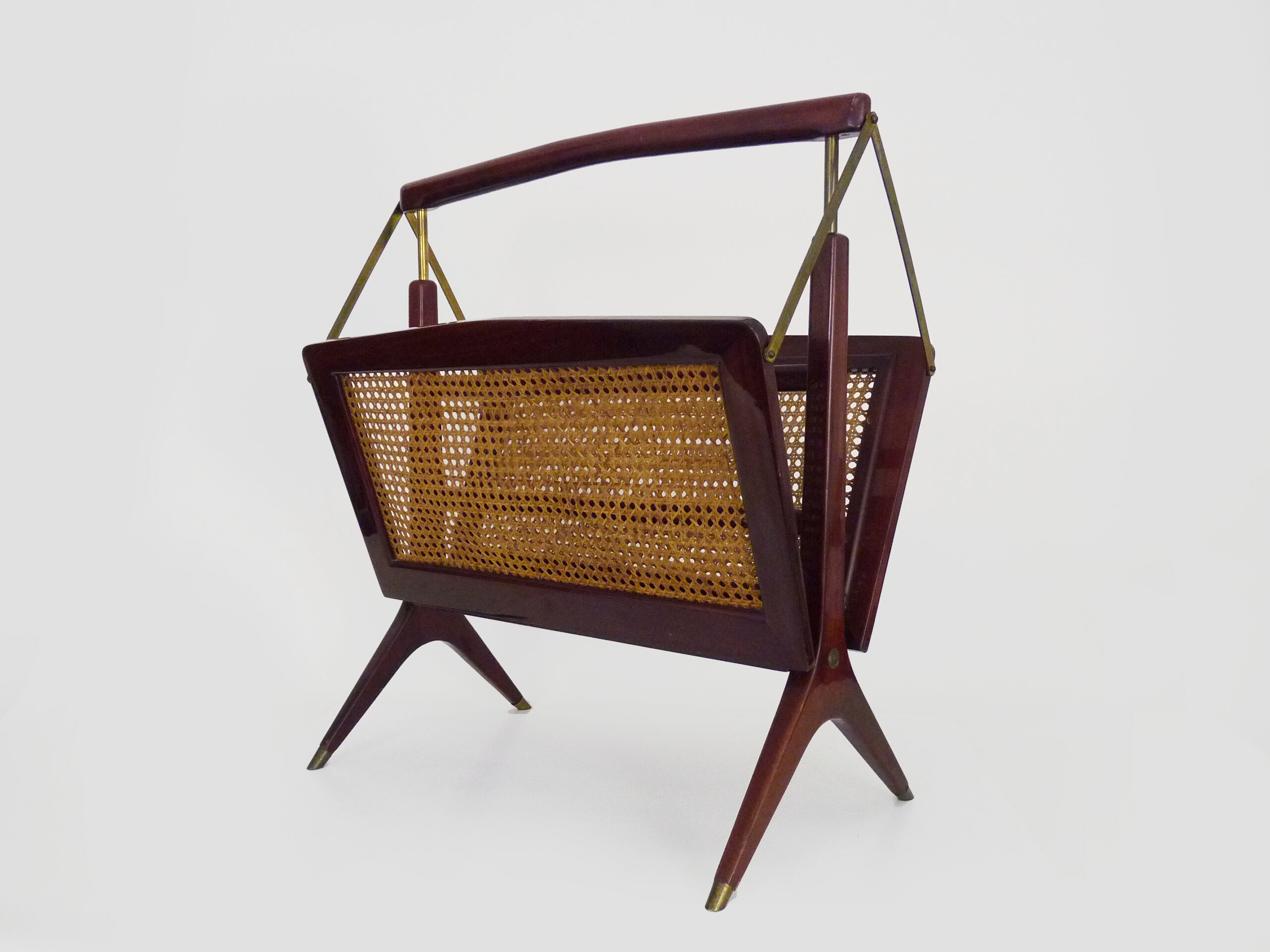 Magazine holders, italy, 1950s. walnut, canage, brass