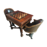 Table à jeux à mécanisme fin XIXième et paire de fauteuils bateaux cuir piétements en bronze