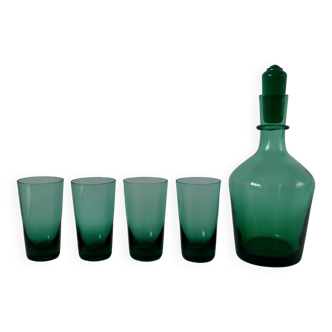 Set of a carafe and 4 designer glasses in green glass from the 70s