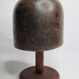 Old solid wood hat shape on foot, 1900