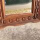 Tramp Art mirror from the 19th century in hand-carved wood.
