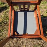 Set of 8 teak lounge chairs with high backs and zebra-striped seats