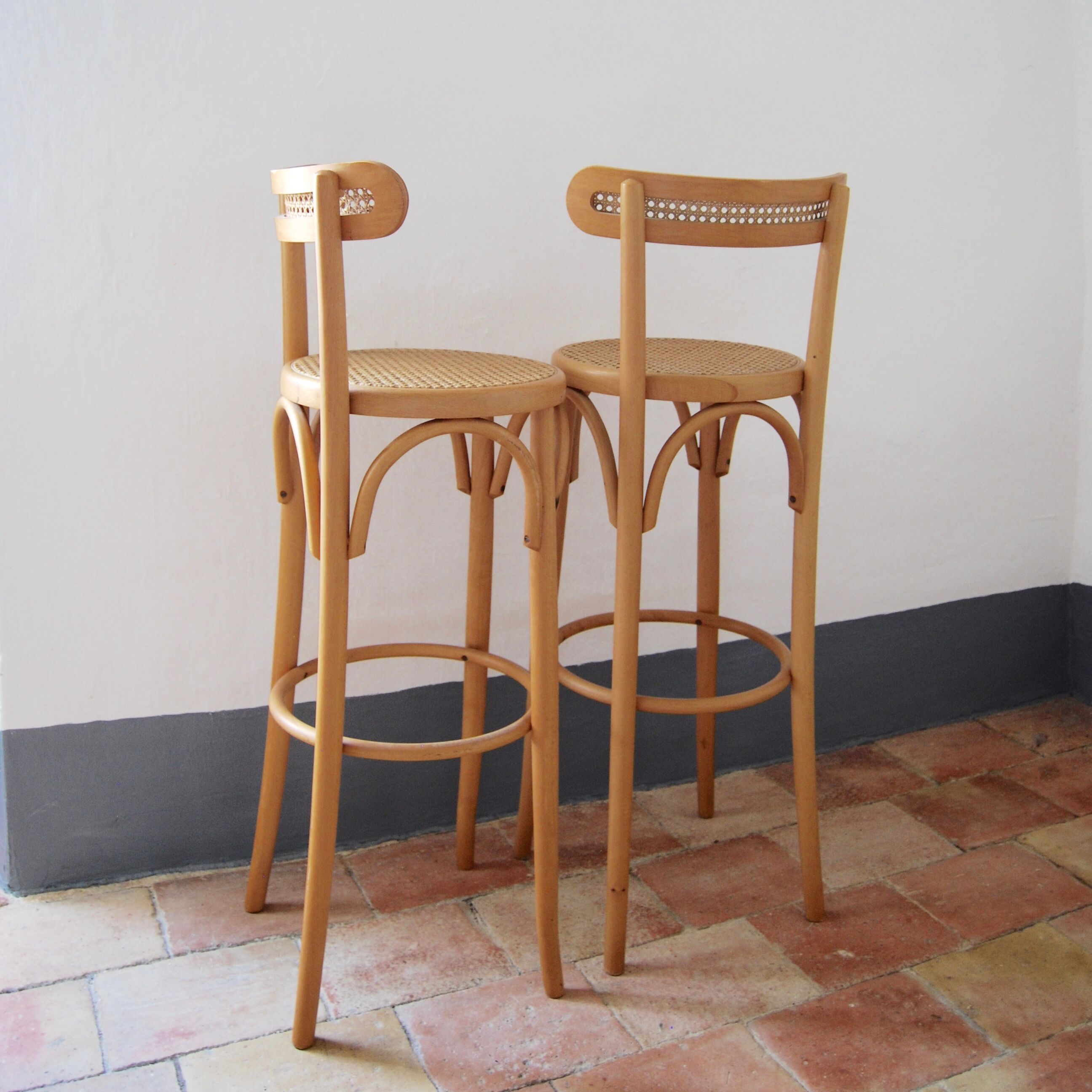 Wooden bar stools and cane