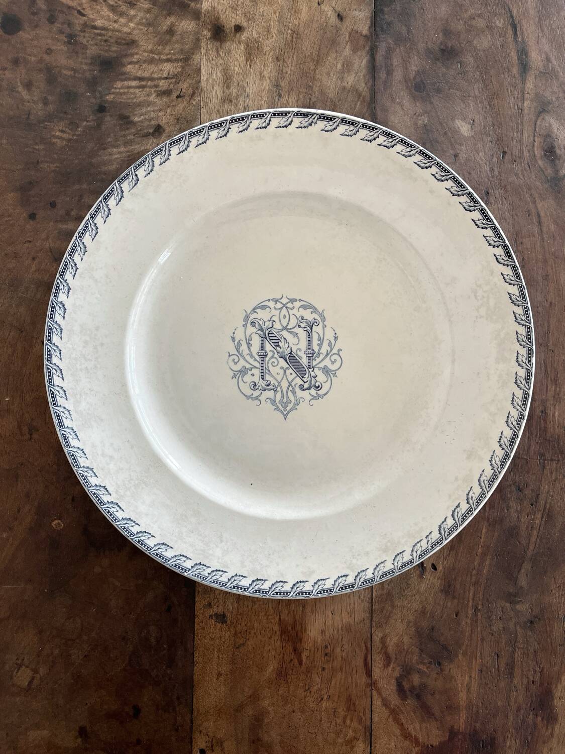 Round iron earth dish monogram “N” KG Lunéville