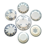 Assiettes à dessert anciennes en terre de ferré accompagnées d'un plat