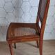 Art Deco caned chair with bronze ornaments.