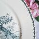 Old mismatched flat plates made of ironstone earthenware.