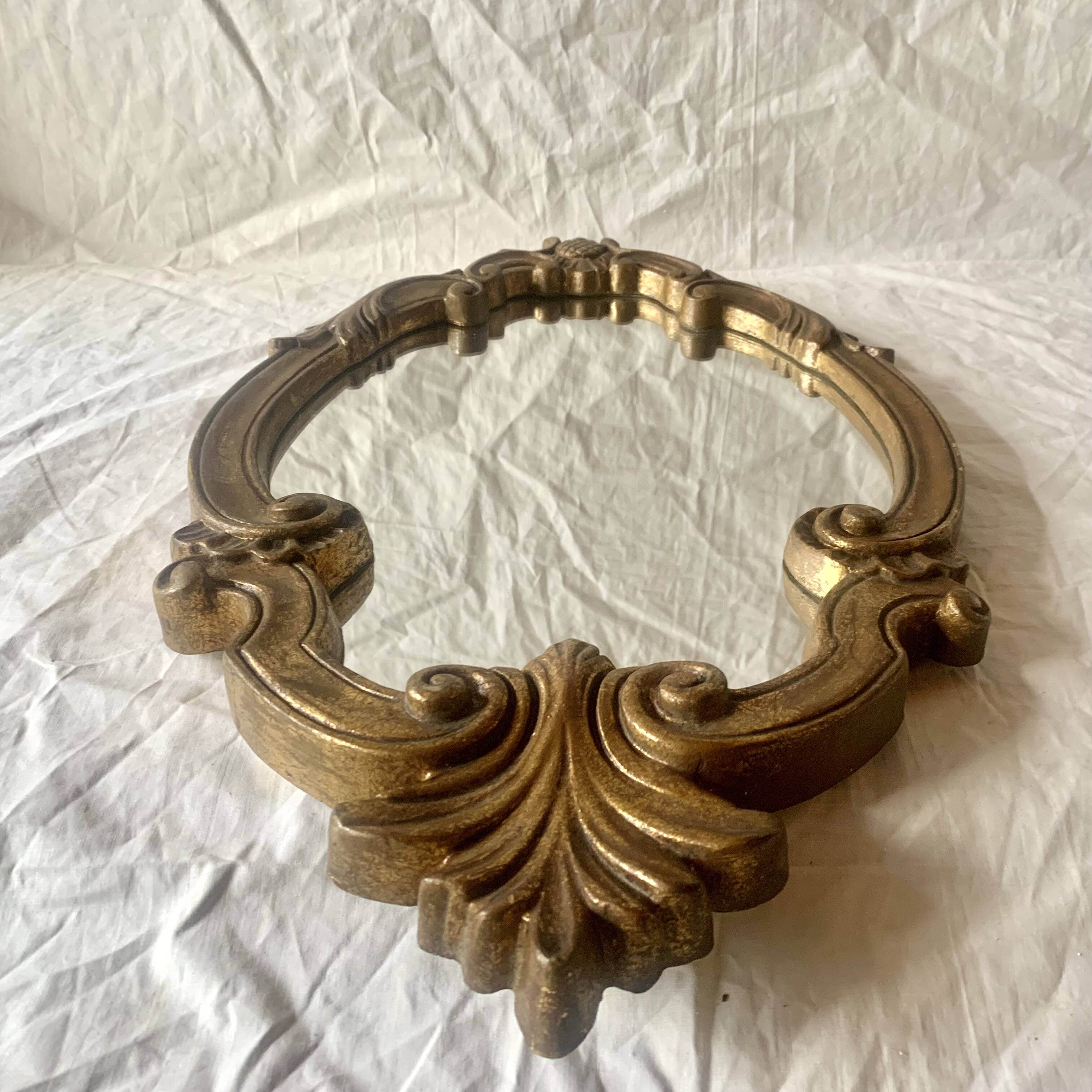 Vintage wall mirror in gold resin