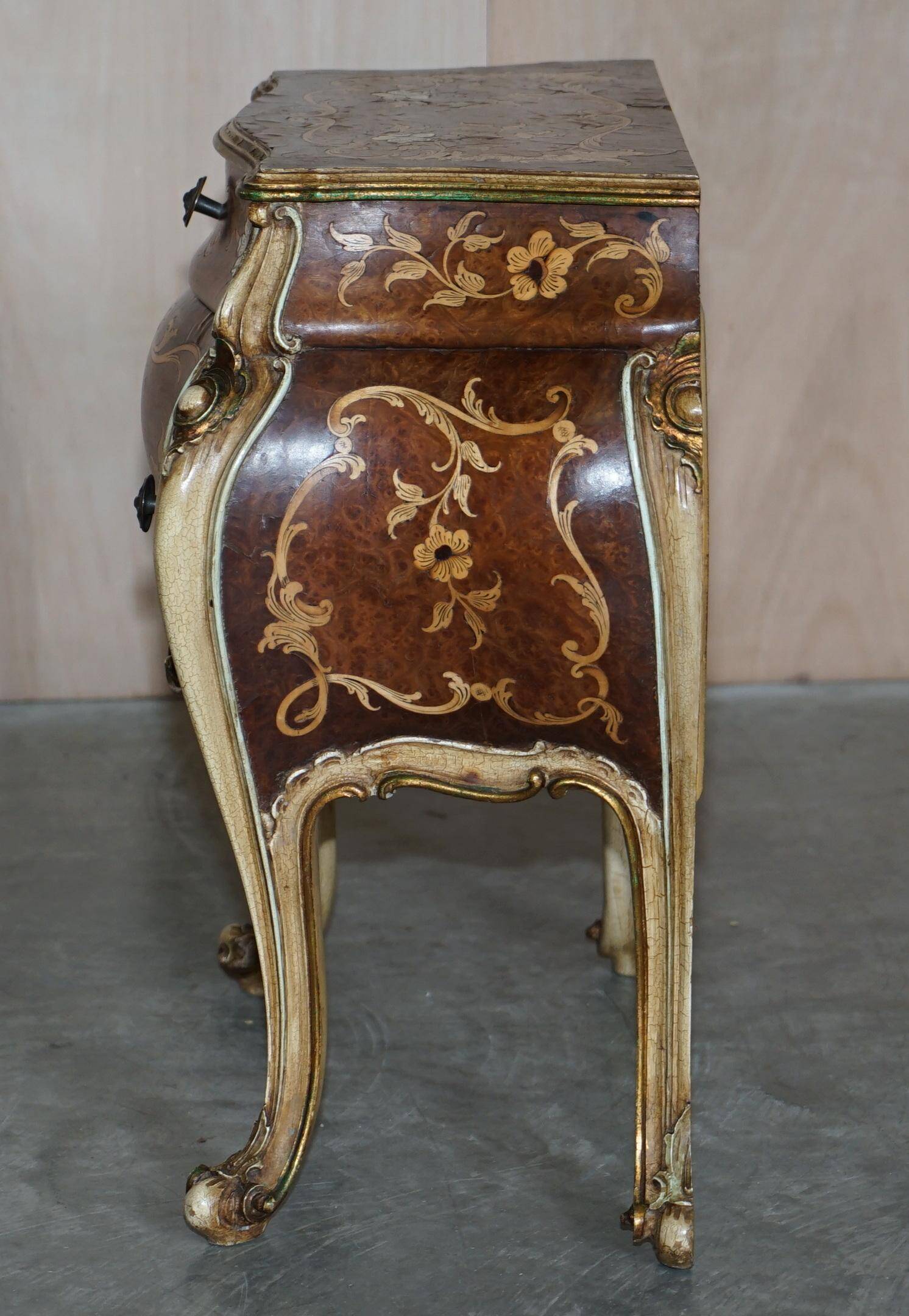 Pair of curved walnut commodes with marquetry and marble tops.