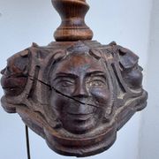 Sculpted wooden lamp with faces, antique.