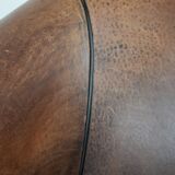 Sturdy vintage sheepskin club armchair with a beautiful patina