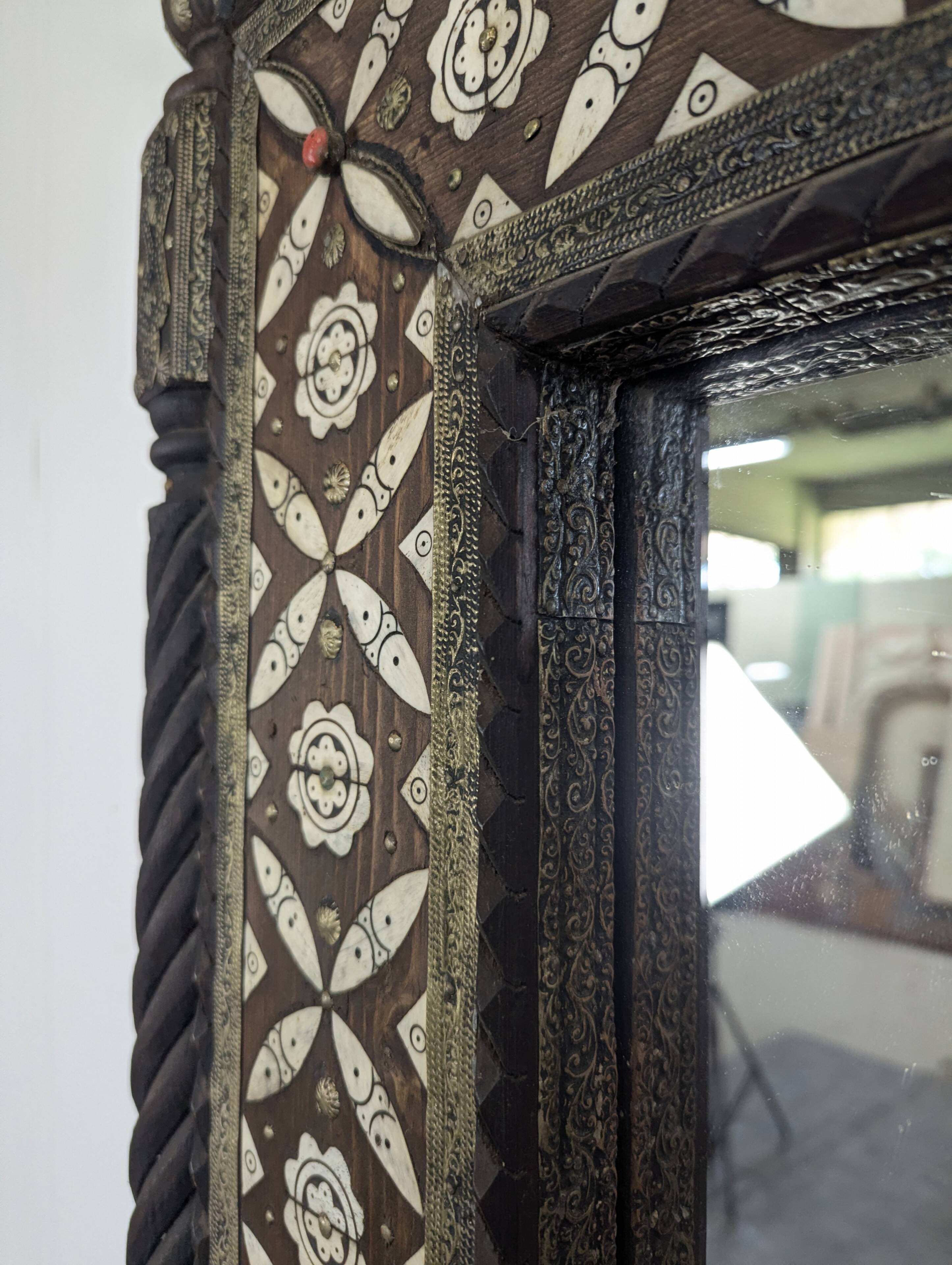 Orientalist mirror with bone inlays and hard stone cabochons.