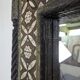 Orientalist mirror with bone inlays and hard stone cabochons.