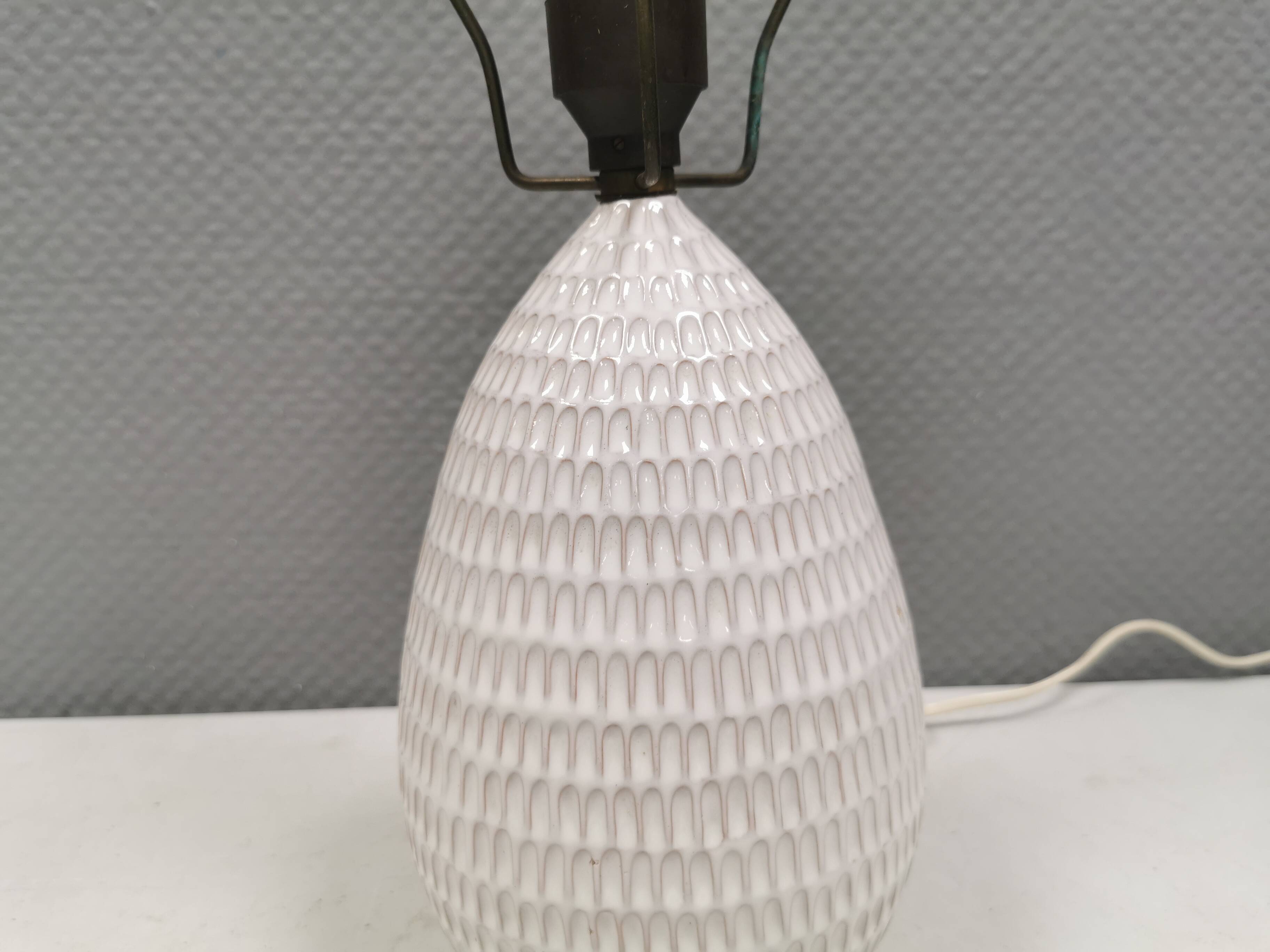 Older ceramic table lamp with beautiful details.