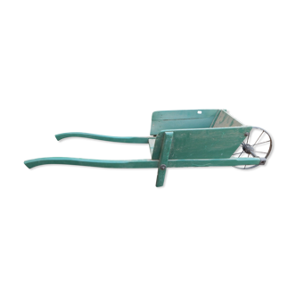 Small wooden wheelbarrow for decoration