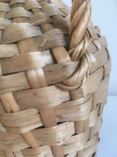 Old lady-jeanne dressed in vintage rattan