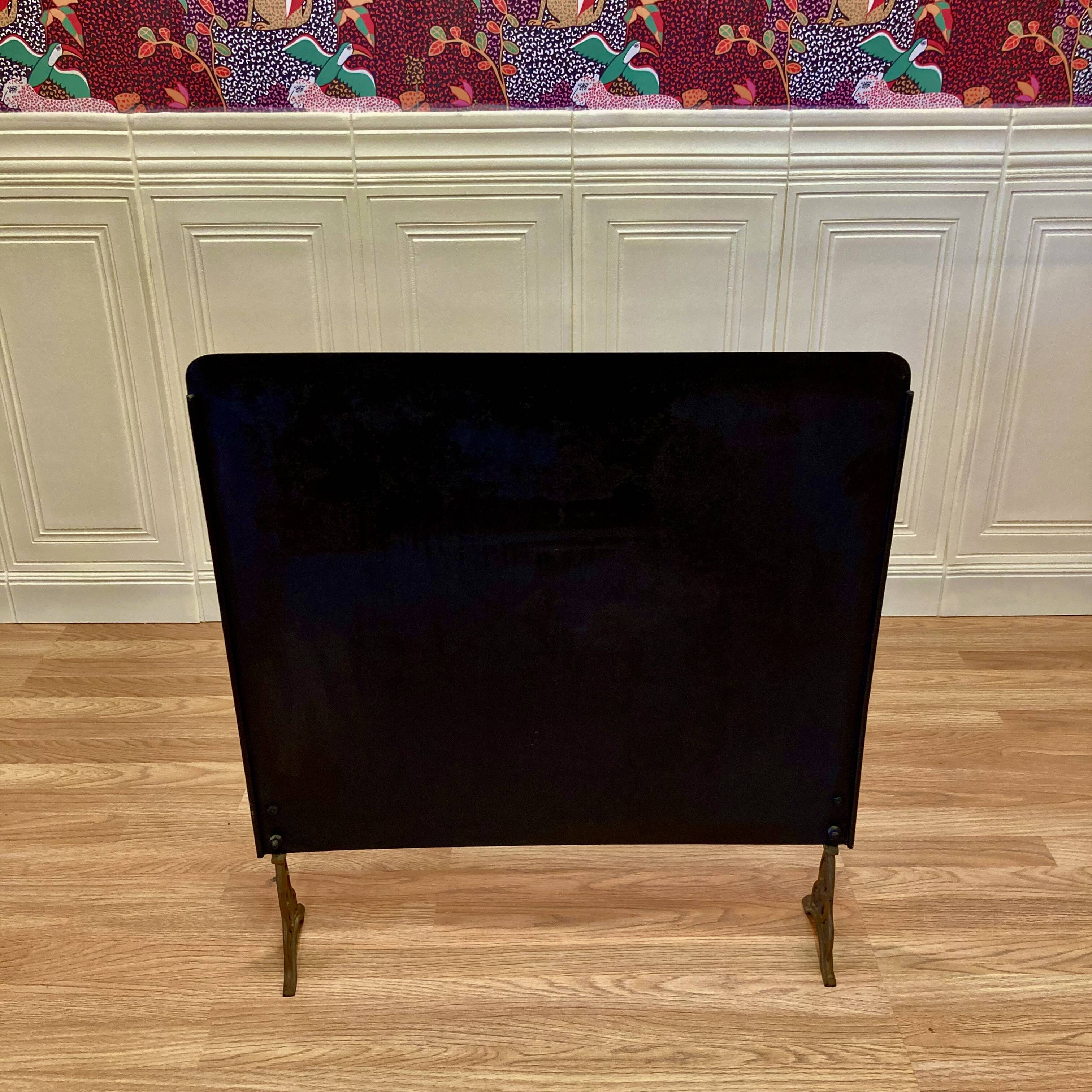 Metal fireplace screen from the period.