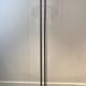 Black lacquered metal floor lamp with brass.