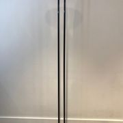 Black lacquered metal floor lamp with brass.