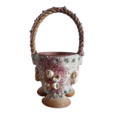 Kitch pot cover in the shape of a shell decore basket