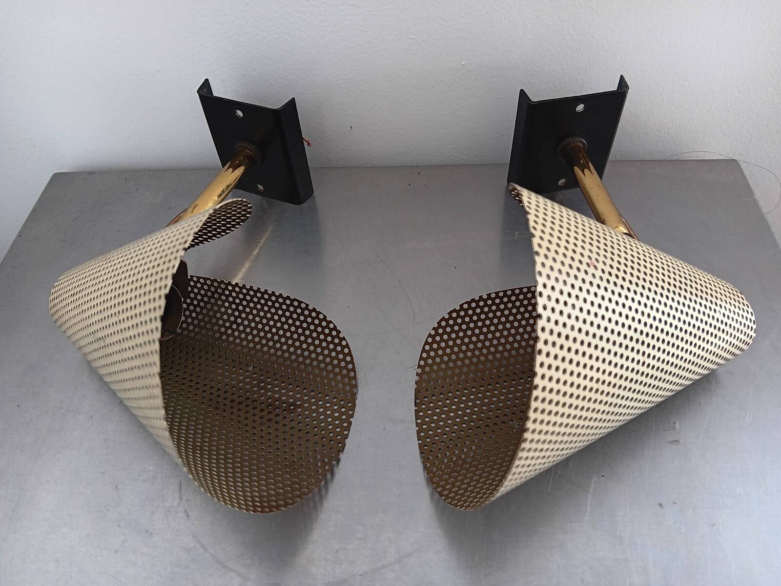 Pair of perforated metal horn wall lights