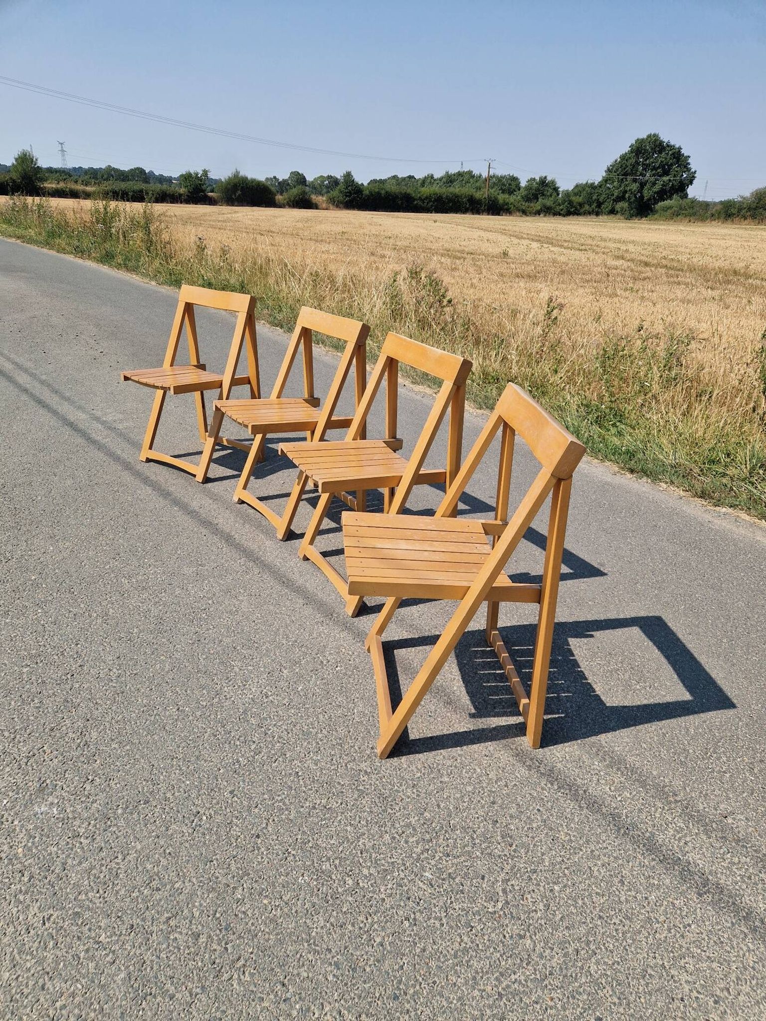 4 chaises pliantes par Aldo Jacober