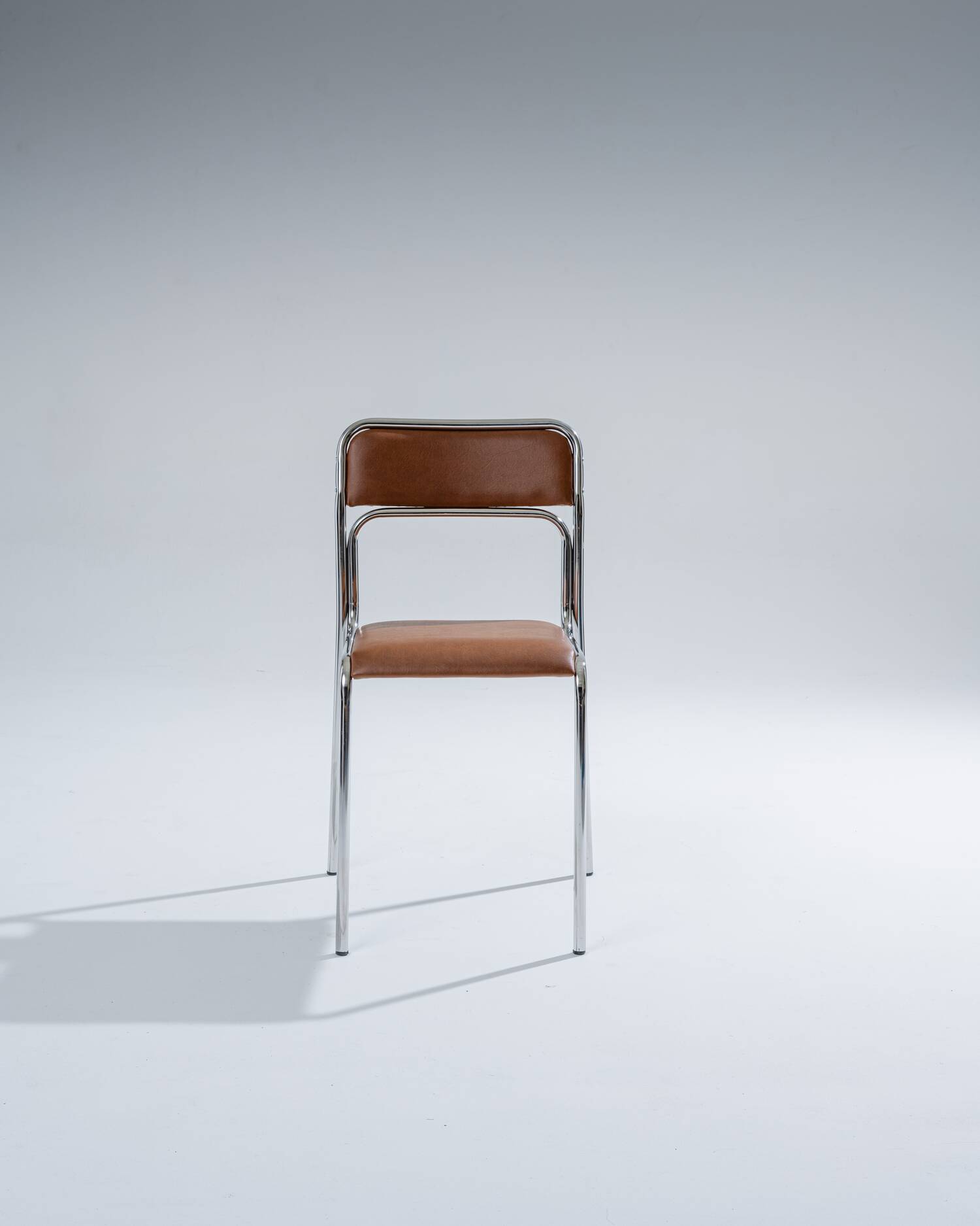 Tubular steel and cognac leatherette chair, 1980s