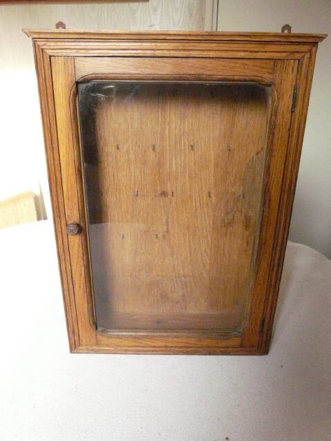 Old watchmaker's furniture wall display case