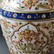 Hindu marble vase with floral decoration and gold leaf, in a box. Height 20 cm.