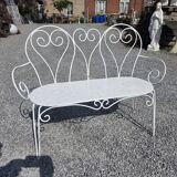 Old garden bench in solid wrought iron