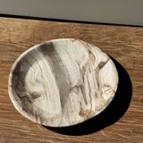 Tray, circular dish or plate made of white striped grey petrified wood.