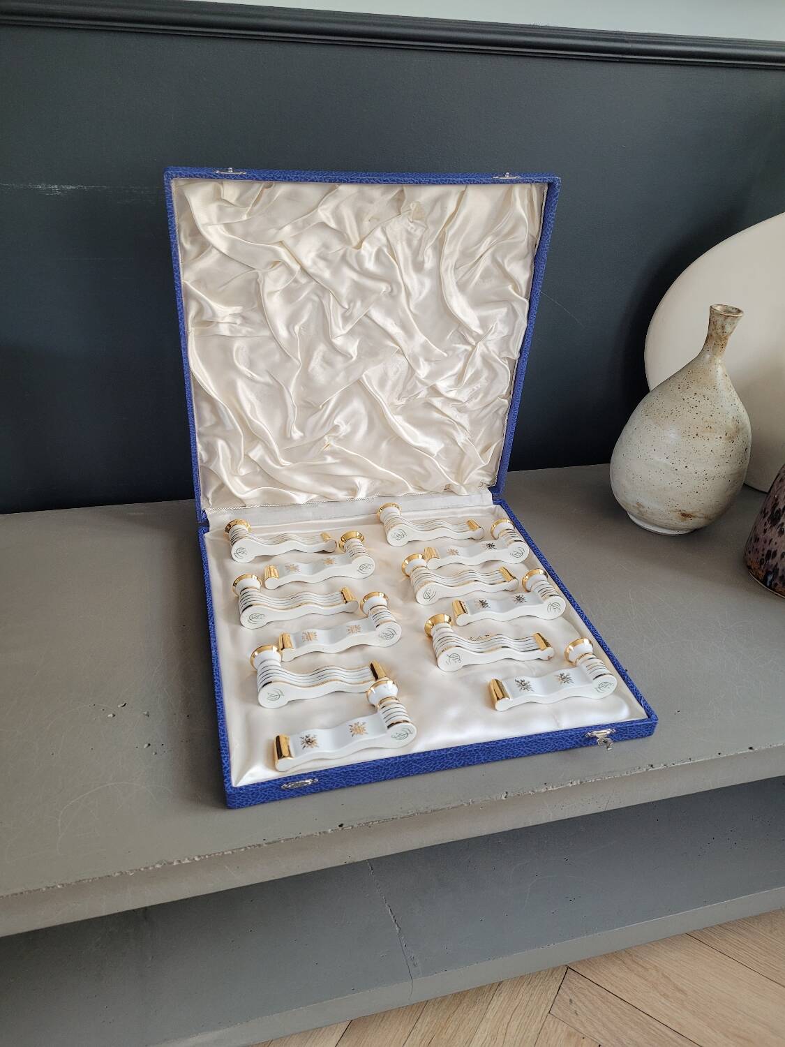 12 Limoges art porcelain knife rests in their case