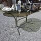 Silver metal table with smoked glass top from the 1970s.