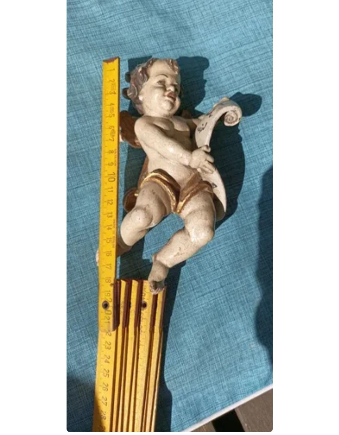 Golden white wooden cherub