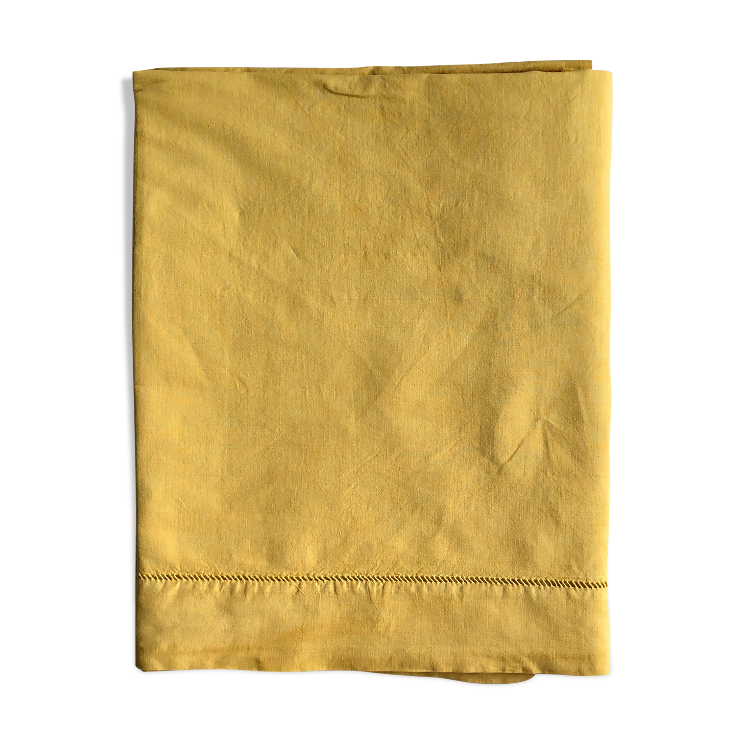 Old linen and cotton sheet tinted in curry yellow