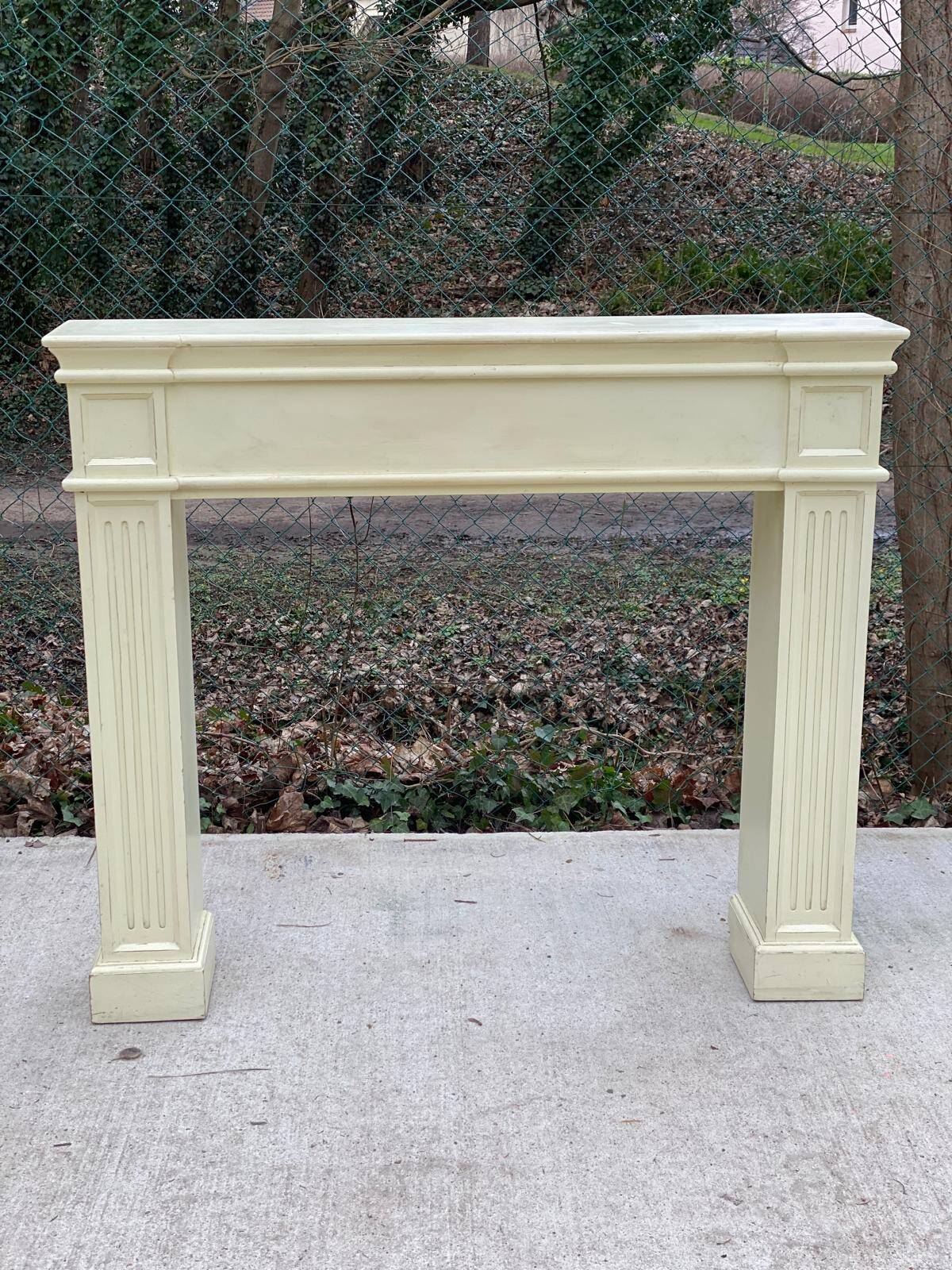 Fireplace surround with beige solid wood mantel
