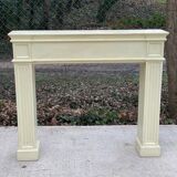 Fireplace surround with beige solid wood mantel