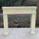Fireplace surround with beige solid wood mantel