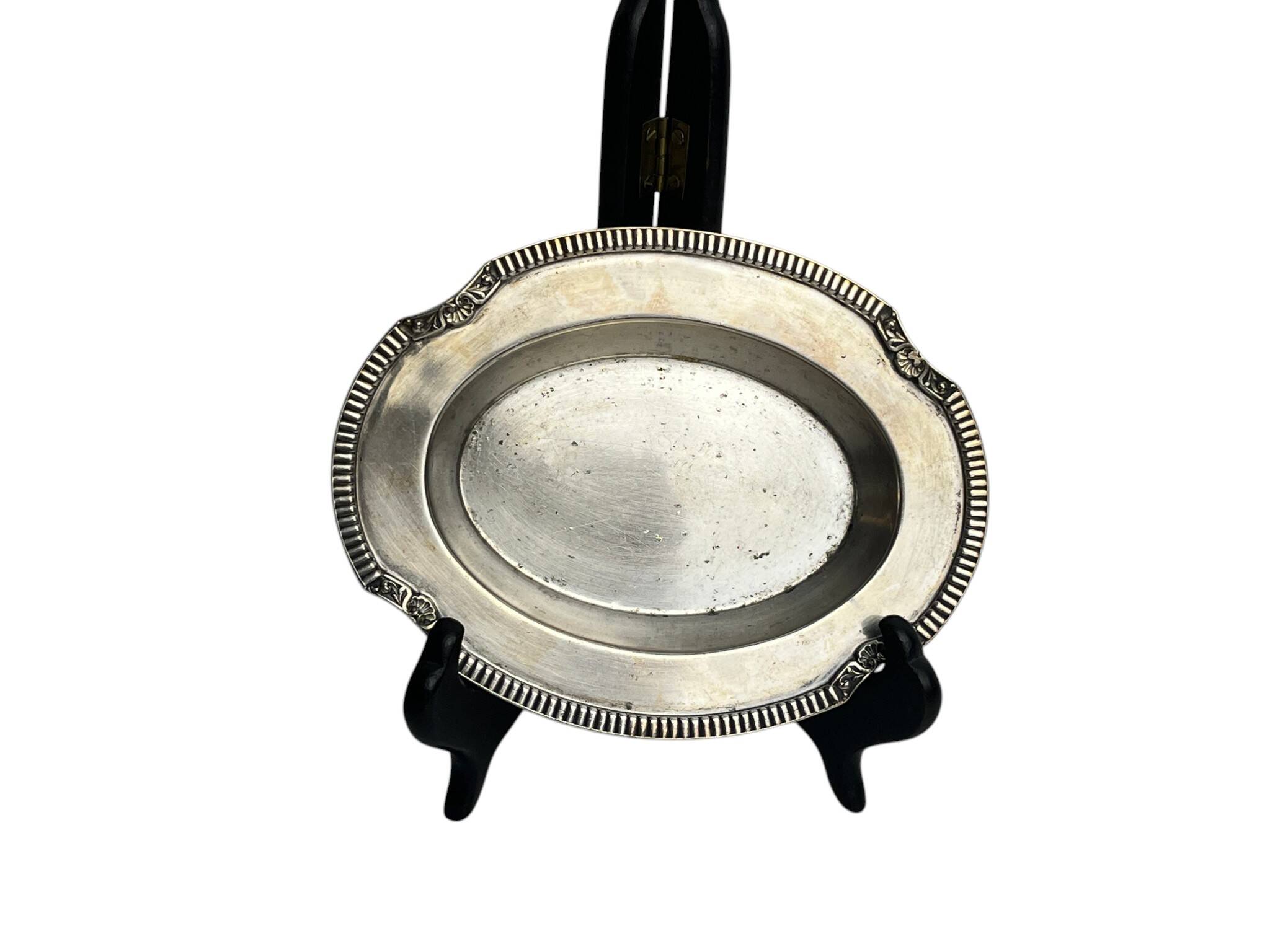 Oval metal silver-plated tray with hallmarks from the early 20th century.