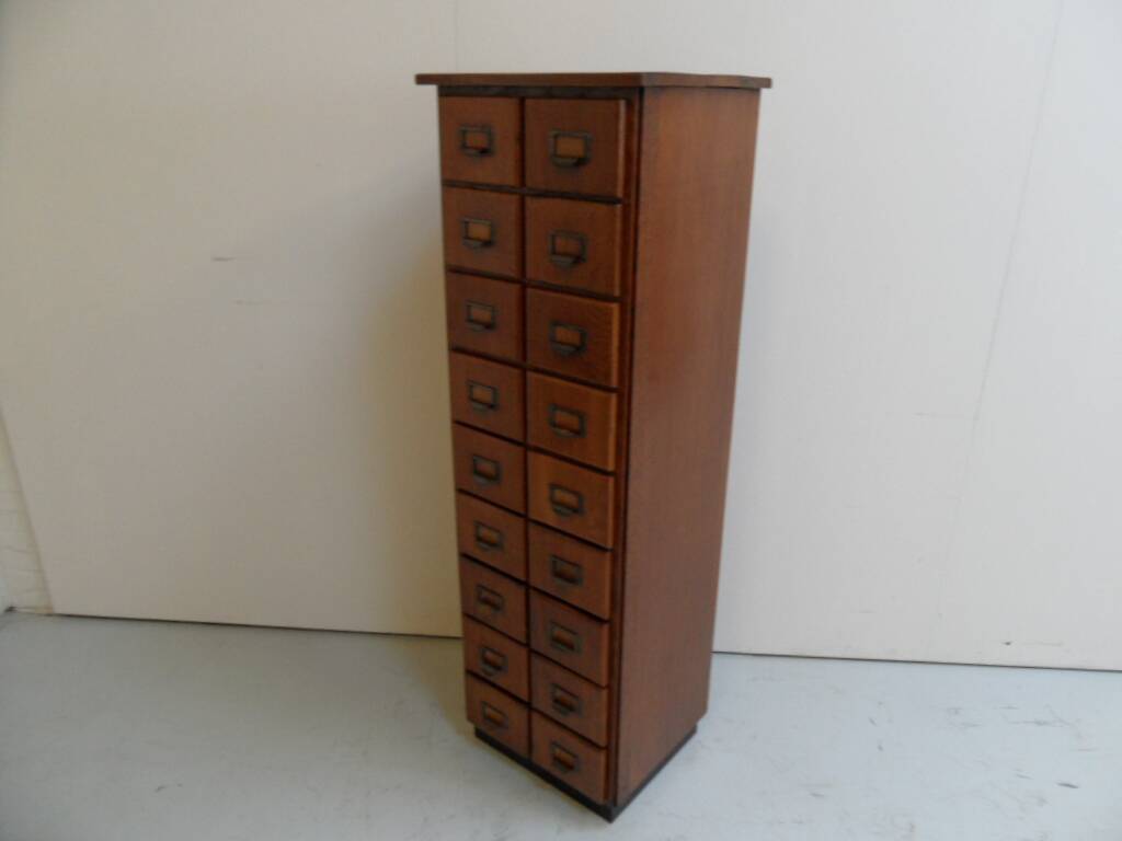 Antique oak apothecary cabinet with drawers