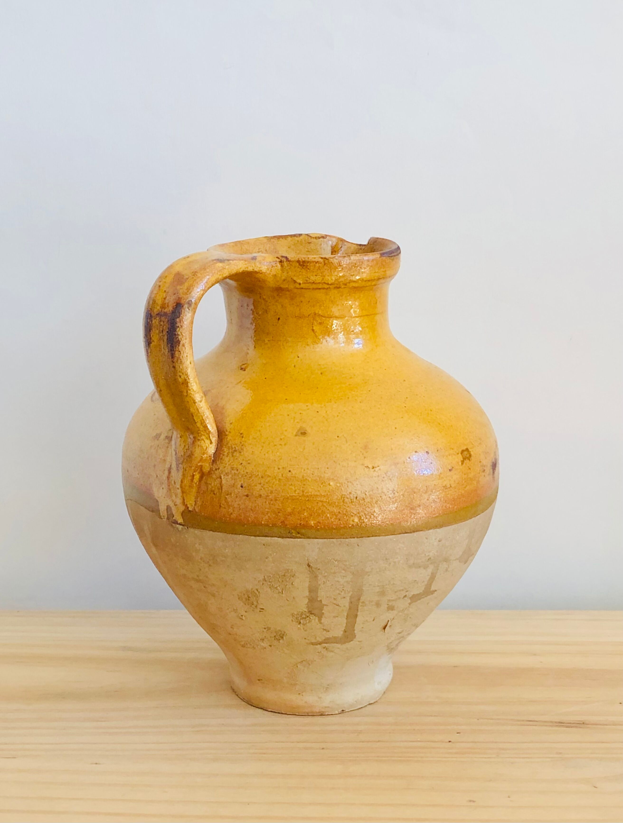 Vintage jug in glazed earth