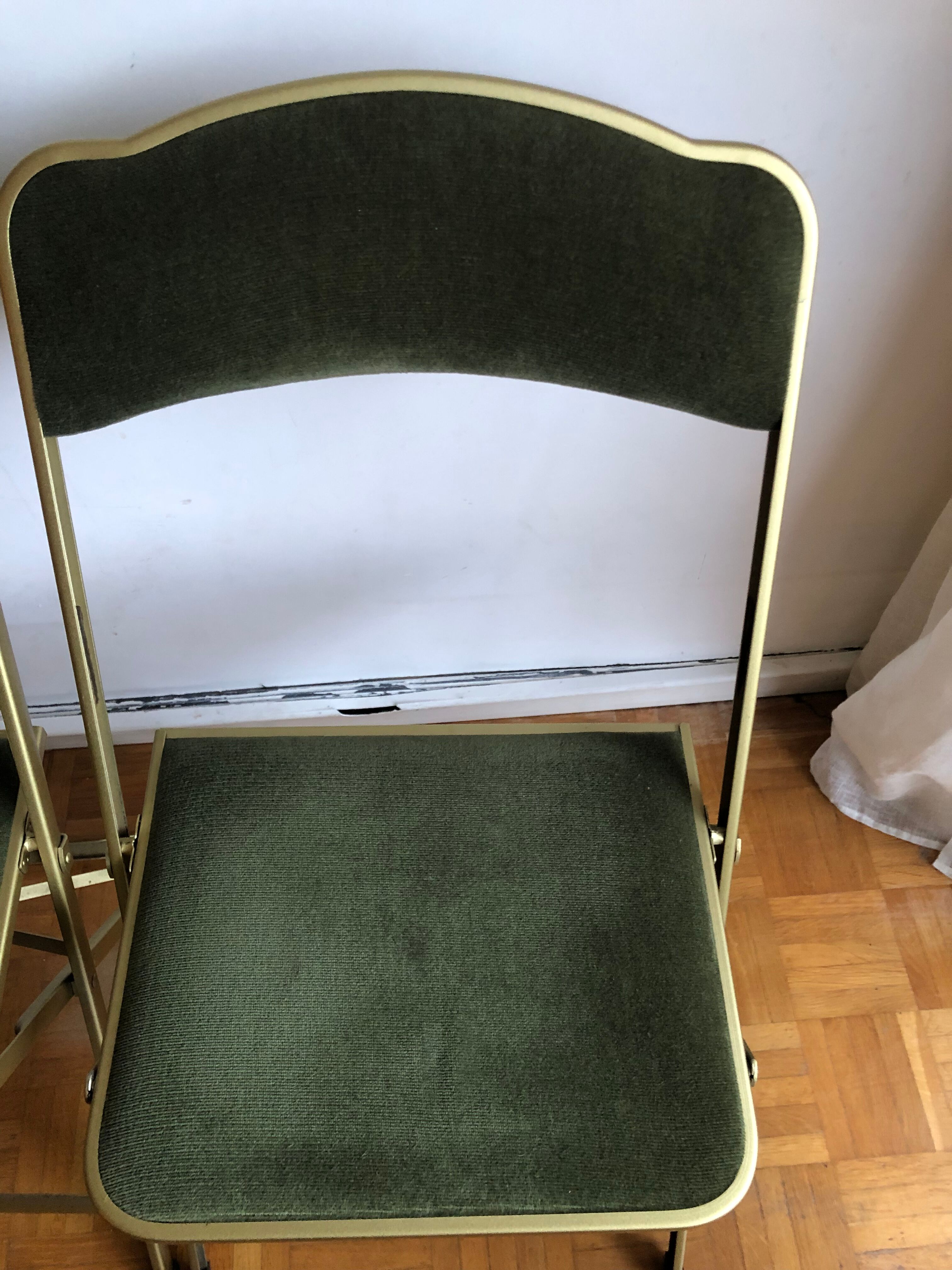Set of three vintage green folding chairs