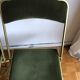 Set of three vintage green folding chairs