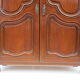 Small solid wooden cabinet with a gendarme hat