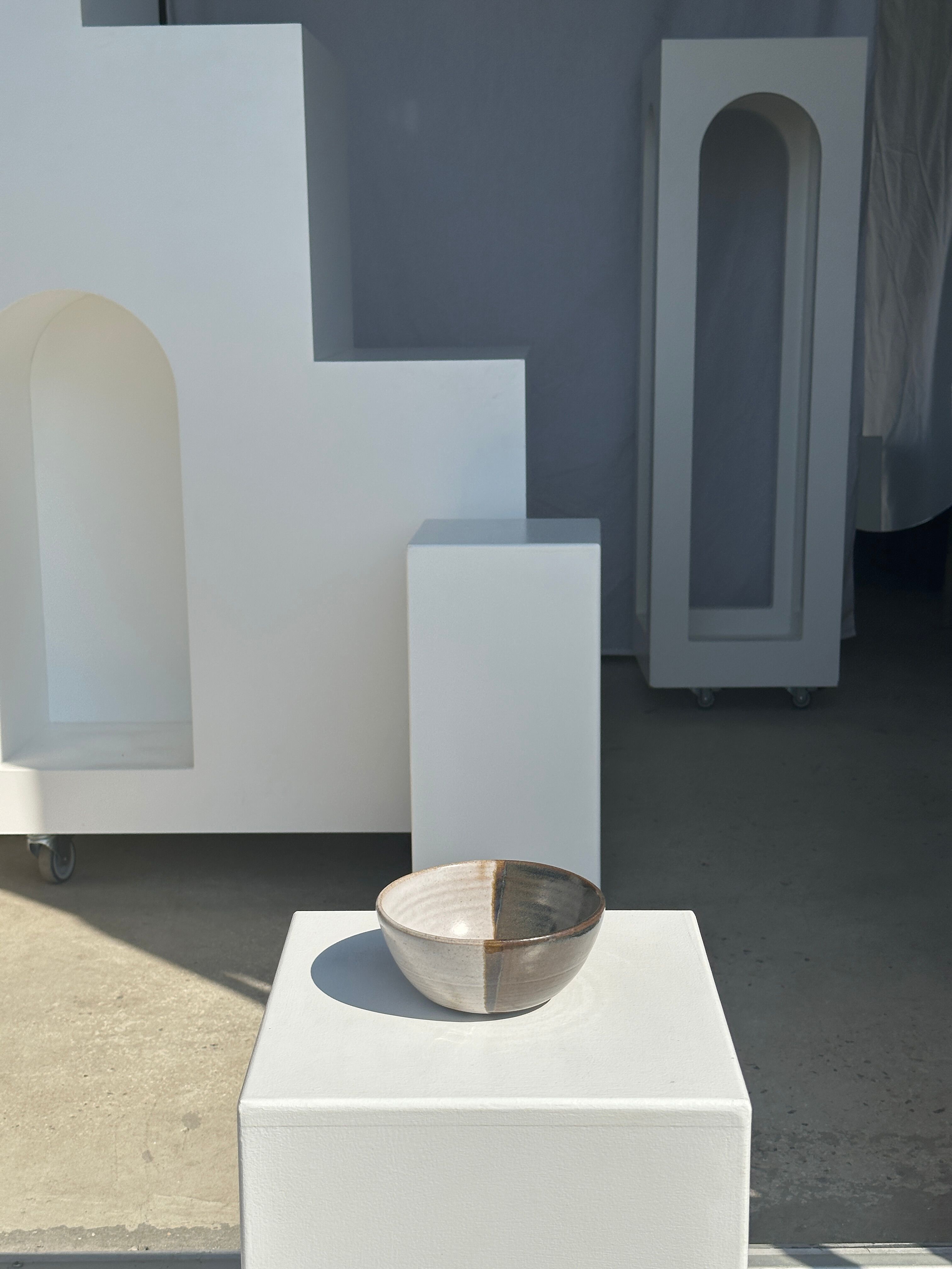 White and glossy brown two-tone ceramic bowl, matt earth