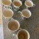 10 slipware cups, pansies