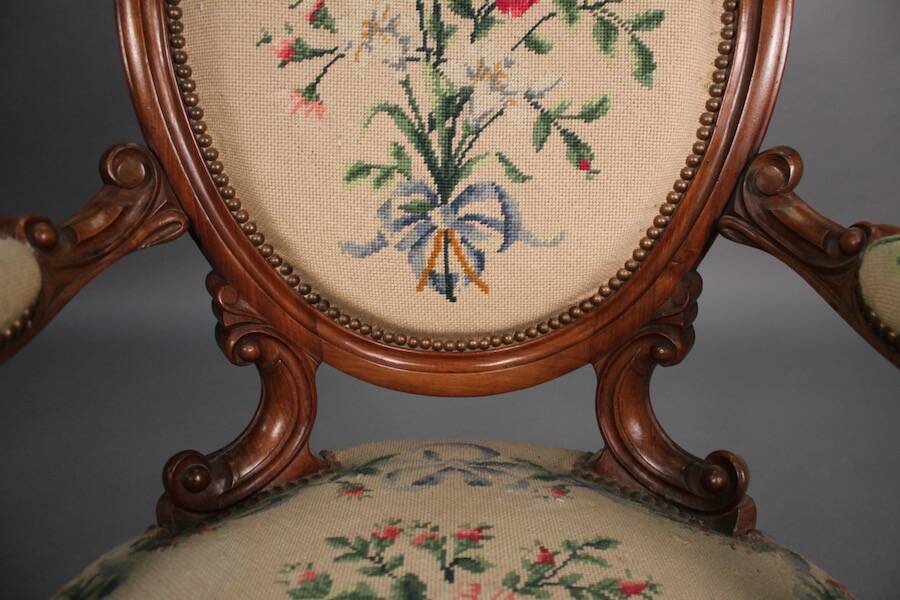 Pair of Louis Philippe armchairs with petit point upholstery.