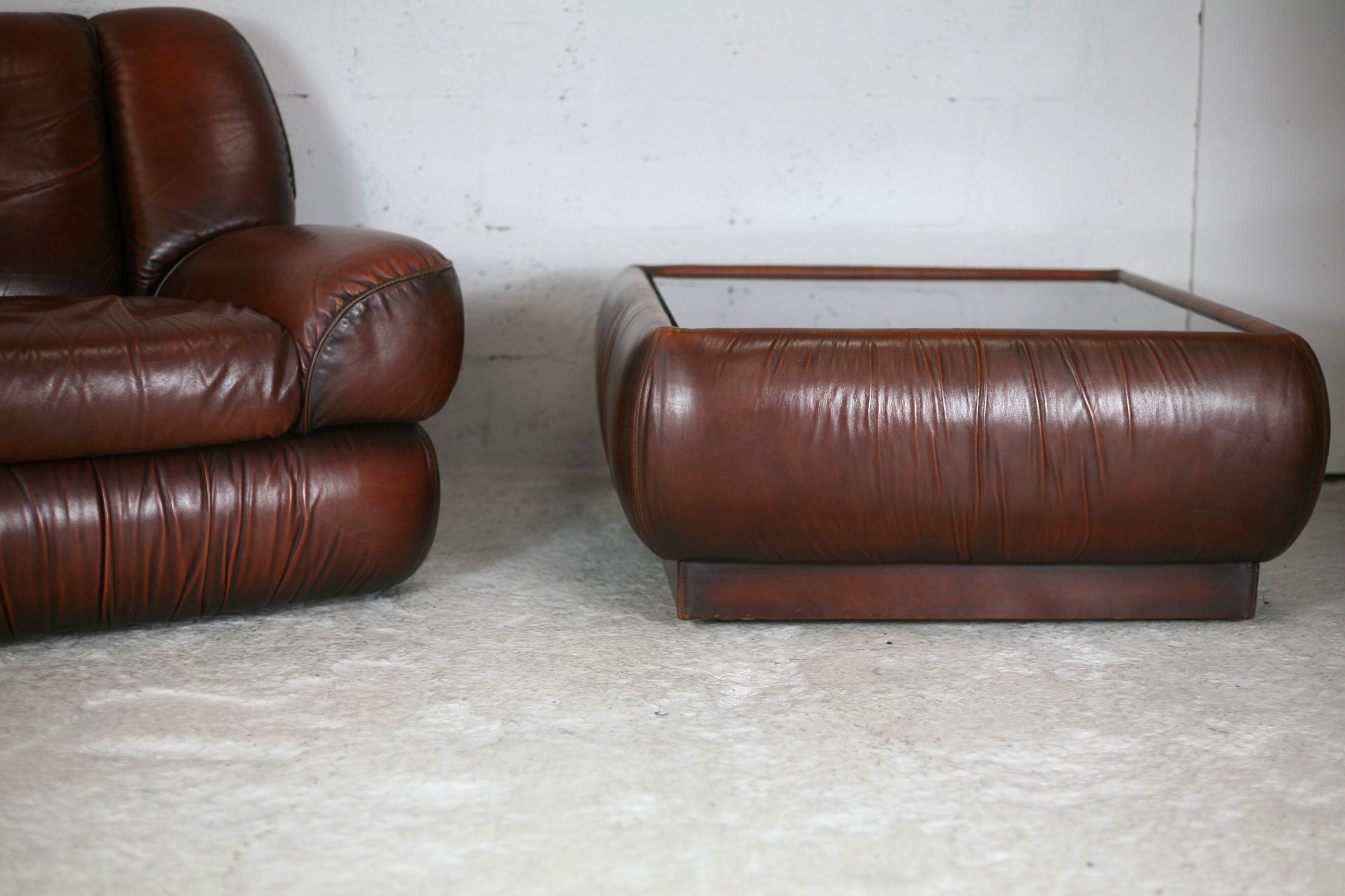 Leather armchair and coffee table set, Italy, circa 1970. Space Age