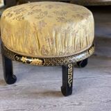 A set of two armchairs, a sofa and two poufs in lacquered wood with gilded chinoiserie decoration.