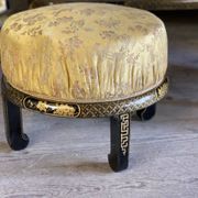 A set of two armchairs, a sofa and two poufs in lacquered wood with gilded chinoiserie decoration.